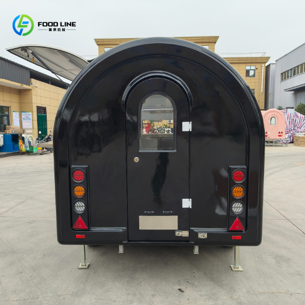 black door of the round trailer