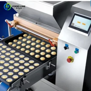 Cupcake depositor machine in action Cupcake depositor machine in action